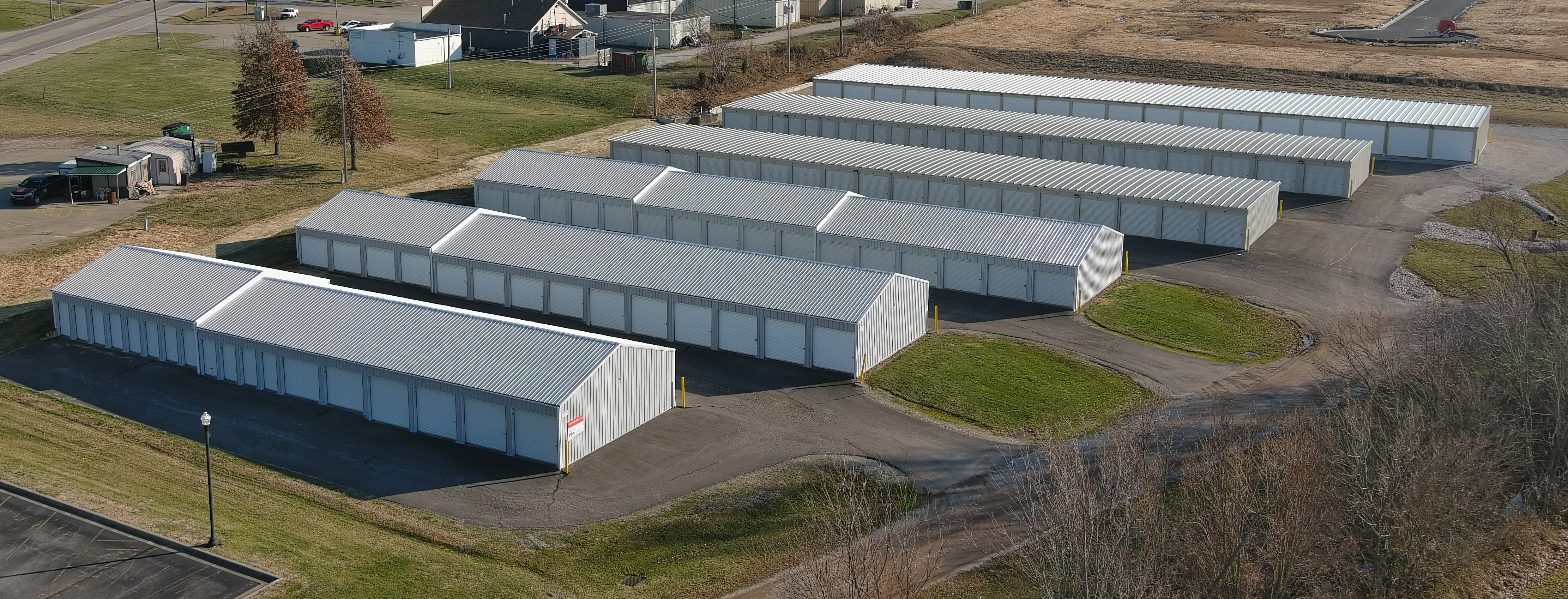 Variety of storage unit sizes with secure white doors and enclosed vehicle parking at the well-designed Mississippi St location.